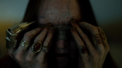 Creepy Hooded Figure with Rings and Claw Desktop Wallpaper