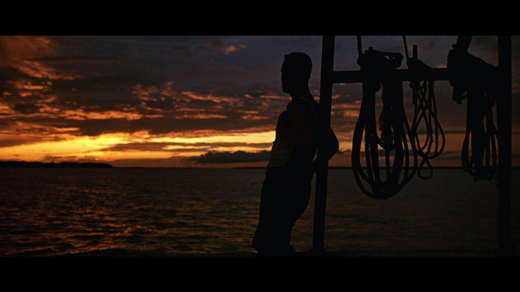 Man Silhouette at Sunset Over Ocean 4K Desktop Wallpaper
