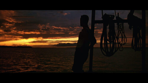 Man Silhouette at Sunset Over Ocean 4K Desktop Wallpaper