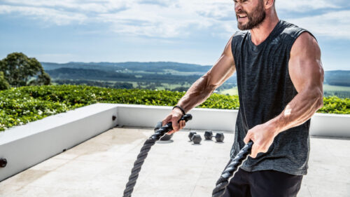 Fit Man Exercising with Battle Ropes Desktop Wallpaper