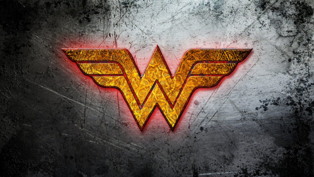 Golden Wonder Woman Emblem on Brushed Metal Desktop Wallpaper