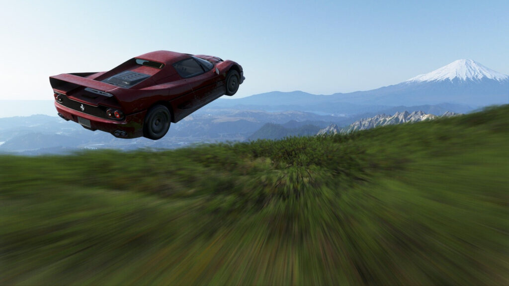 Ferrari F50 Jumping Over Mountain Landscape Desktop Wallpaper
