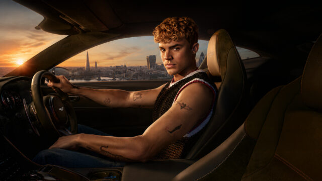 Young Man Driving an Aston Martin in London Desktop Wallpaper