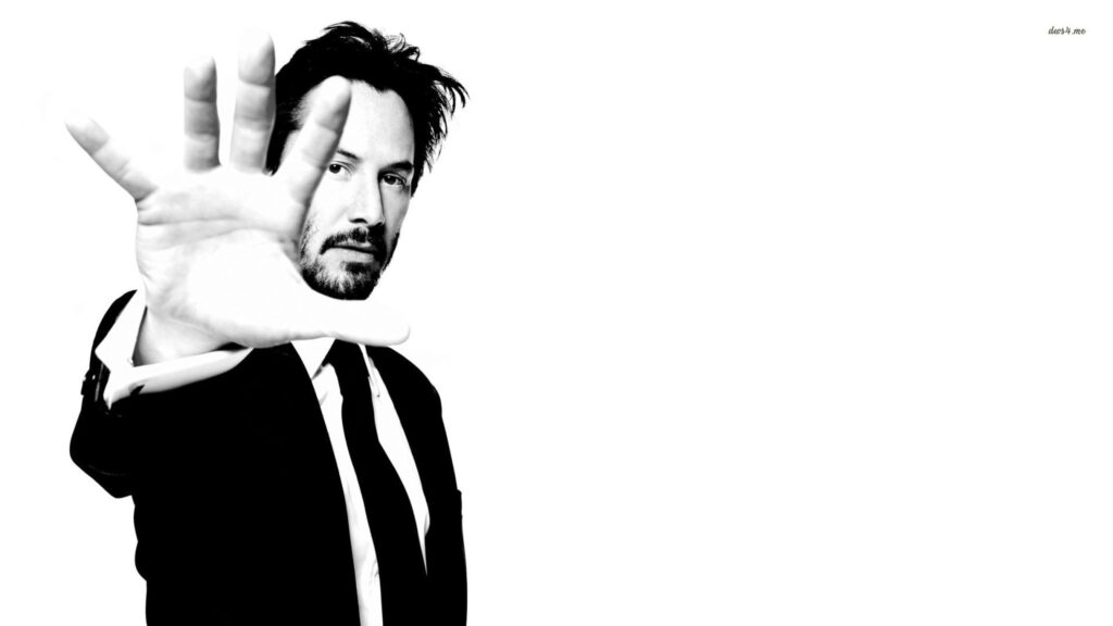Keanu Reeves Monochrome Hand Gesture 4K Desktop Wallpaper