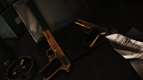 Gold Engraved Pistols on Laptop 4K Wallpaper