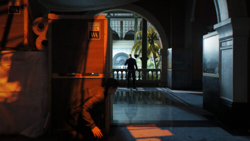Hitman Agent 47 Lurking Behind Crates Desktop Wallpaper
