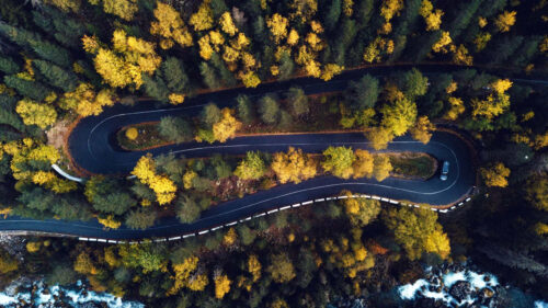 Winding Mountain Road Through Autumn Forest Desktop Wallpaper