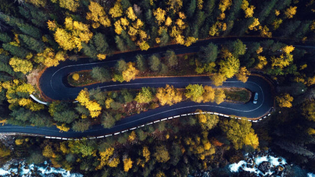 Winding Mountain Road Through Autumn Forest Desktop Wallpaper