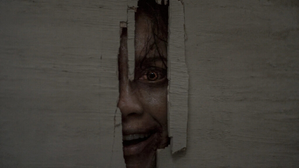 Horror Movie Character Peeking Through Wall Desktop Wallpaper
