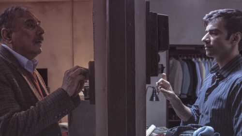 Two Men Interacting at a Switchboard Desktop Wallpaper