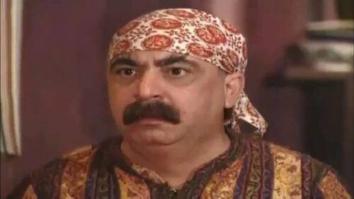 Middle Eastern Man with Mustache and Headscarf Desktop Wallpaper