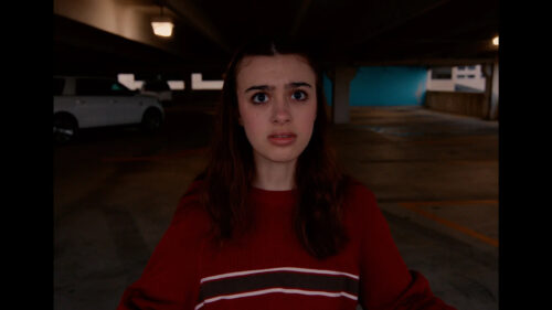 Young Woman in Parking Garage Desktop Wallpaper