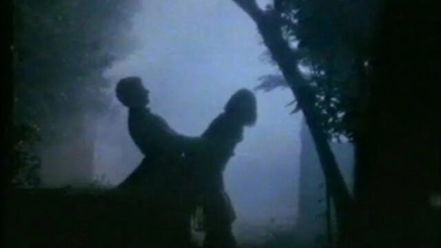 Silhouetted Romantic Figures in Mist Desktop Wallpaper