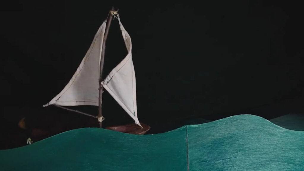Minimalist Miniature Sailing Boat Amidst Paper Waves Desktop Wallpaper