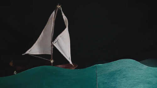 Minimalist Miniature Sailing Boat Amidst Paper Waves Desktop Wallpaper