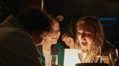 Friends Laughing Together at Night Desktop Wallpaper