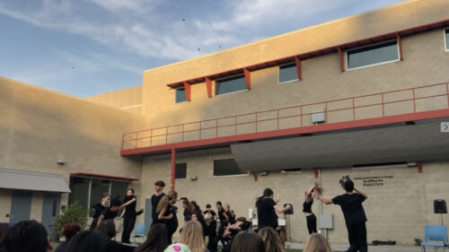 Performing Arts Students Rehearsing on Plaza Stage Desktop Wallpaper