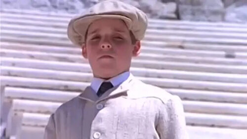 Young Indiana Jones Standing on Marble Steps Desktop Wallpaper
