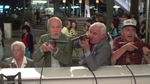 Leslie Nielsen and Friends Shooting at a Carnival Desktop Wallpaper