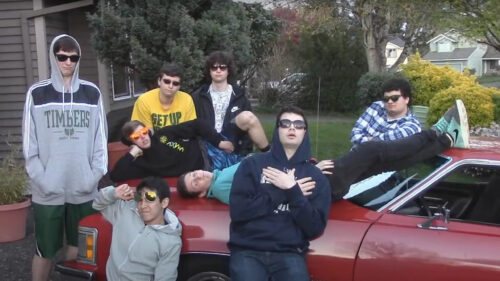Group of Friends Posing on a Classic Red Car Desktop Wallpaper