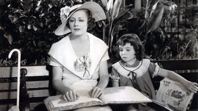 Irene Dunne and child reading a book Desktop Wallpaper