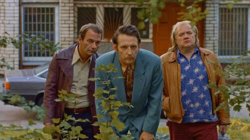 Three Men Observing in a Suburban Setting Desktop Wallpaper