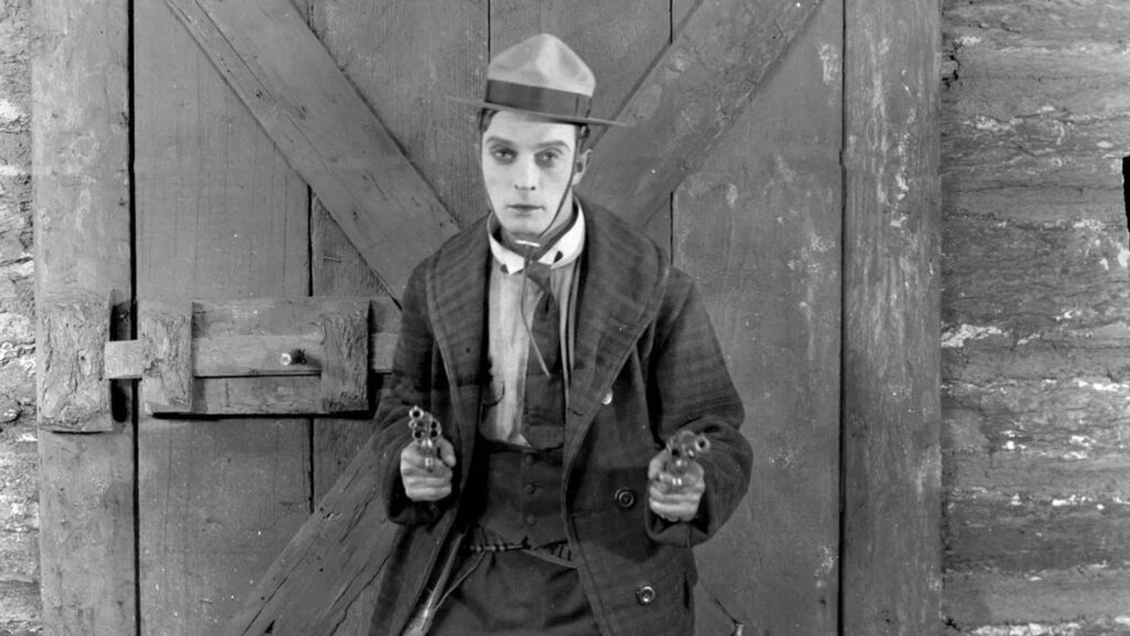 Buster Keaton Holding Pistols Black and White Desktop Wallpaper