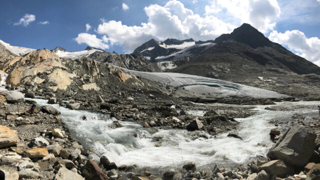 Majestic Alpine Glacier and River Flow Desktop Wallpaper