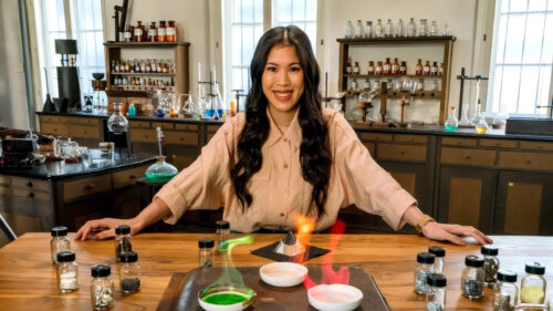 Woman Conducting Chemistry Experiment Desktop Wallpaper