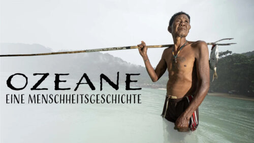 Fisherman with Spear in Turquoise Waters Desktop Wallpaper