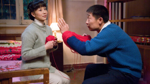 Couple Knitting Together at Home Desktop Wallpaper