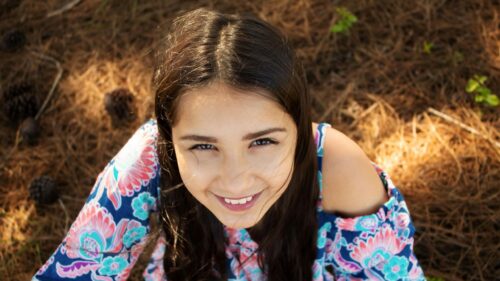 Smiling Brunette Girl Portrait in Nature Forest Desktop Wallpaper