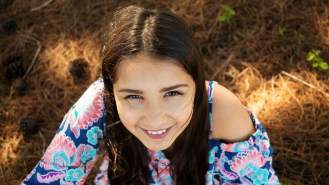 Smiling Brunette Girl Portrait in Nature Forest Desktop Wallpaper