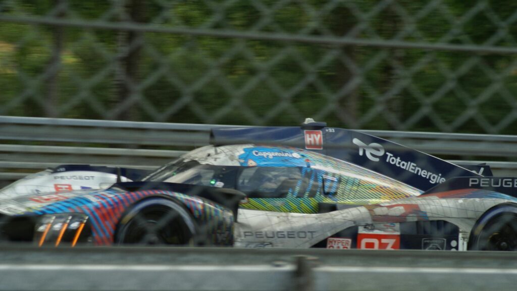 Peugeot 9X8 Hypercar Racing on Track Desktop Wallpaper