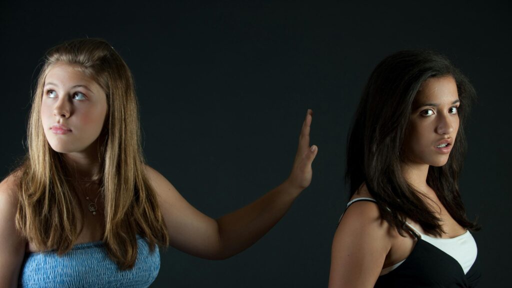 Two Teenage Girls Expressing Conflict High Quality PC Wallpaper