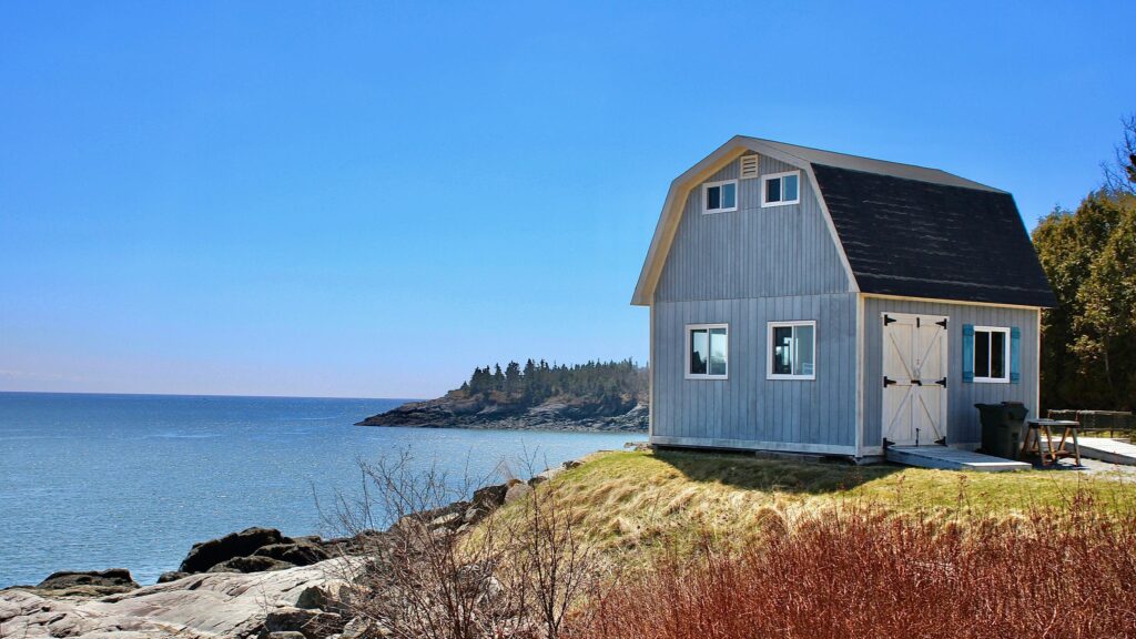 Rustic Coastal Cottage by the Ocean Shore Desktop Wallpaper