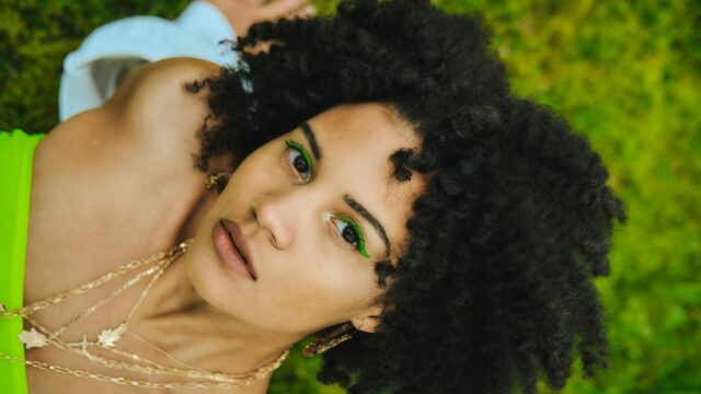 Stunning Woman with Neon Green Eyeliner Portrait 4K Wallpaper