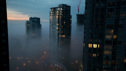 High-Rise Cityscape in Dense Morning Fog Desktop Wallpaper
