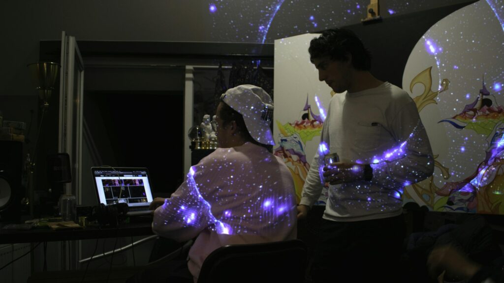 Creative Studio Friends Working on Digital Art Project 4K Wallpaper