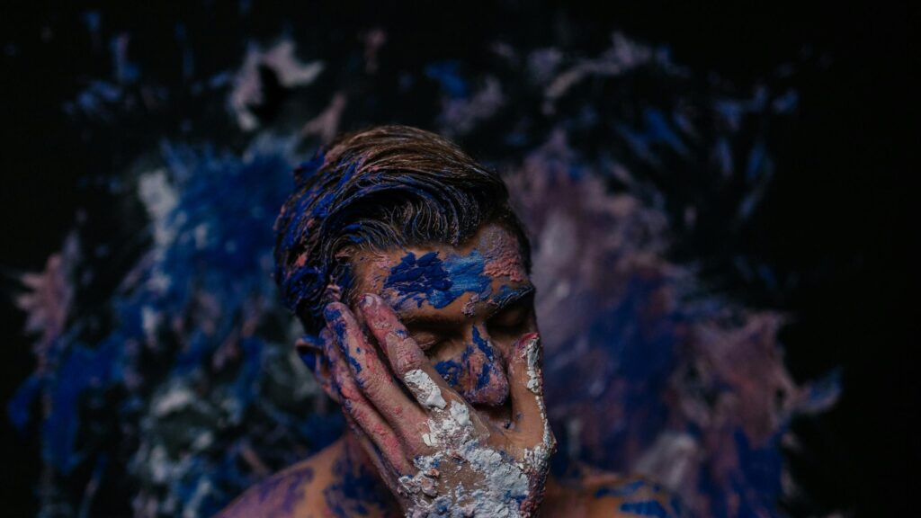 Artistic Man Covered in Blue and Pink Paint Desktop Wallpaper