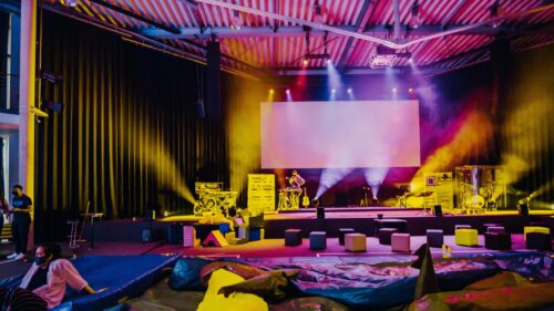 Concert Stage Performance with Vibrant Lighting 4K Wallpaper