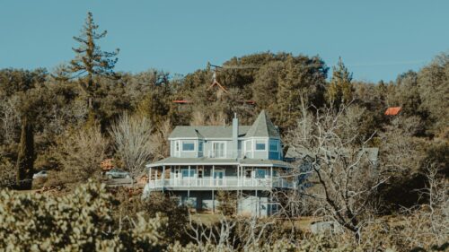 Picturesque Countryside Two-Story Home in the Forest Desktop Wallpaper