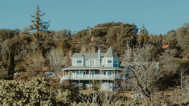 Picturesque Countryside Two-Story Home in the Forest Desktop Wallpaper