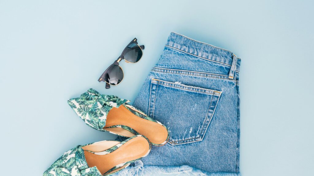 Summer Fashion Flat Lay with Denim Shorts and Tropical Sandals Desktop Wallpaper
