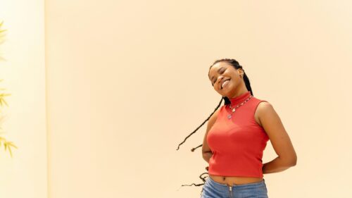 Happy Young Woman Smiling in Red Top 4K Desktop Wallpaper