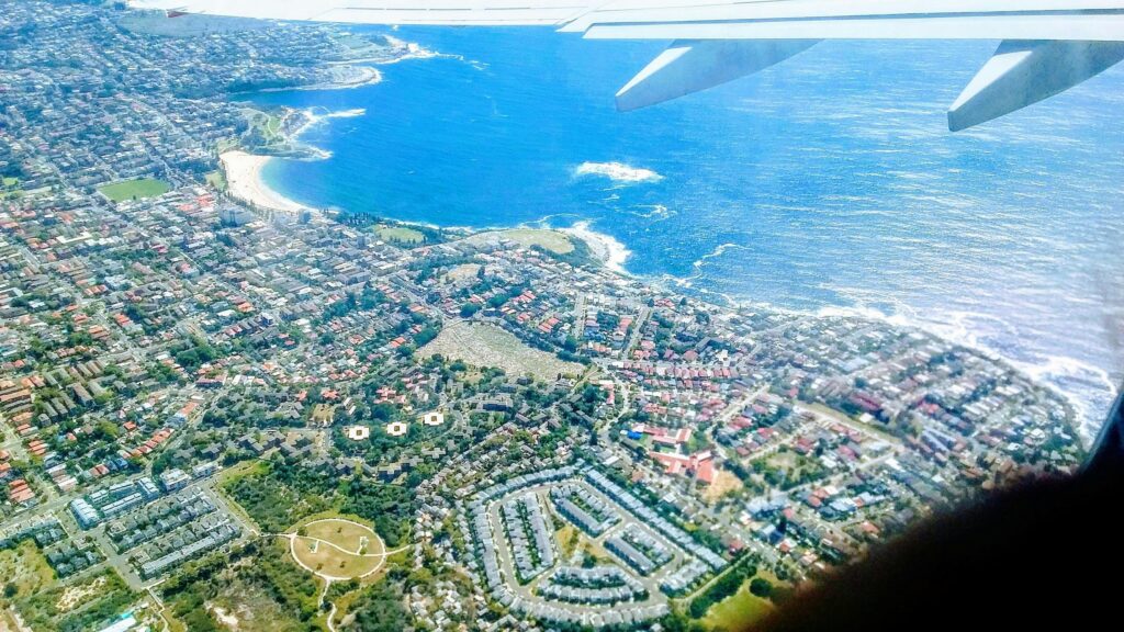 Aerial View of Coastal City and Beach Paradise Desktop Wallpaper