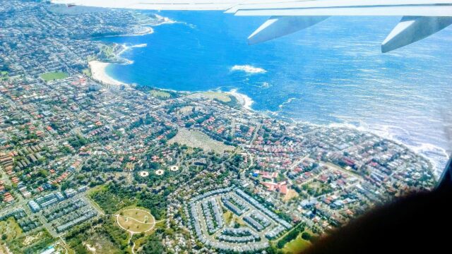 Aerial View of Coastal City and Beach Paradise Desktop Wallpaper