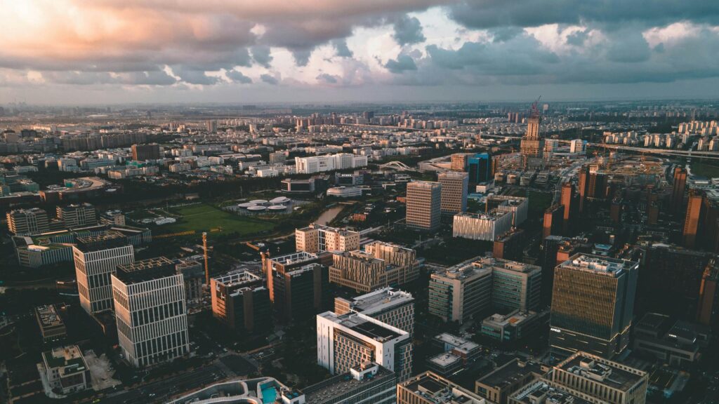 Stunning Aerial View of Modern City Skyline at Sunset 4K Desktop Wallpaper