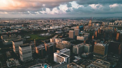Stunning Aerial View of Modern City Skyline at Sunset 4K Desktop Wallpaper