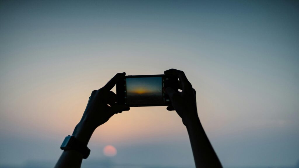 Silhouette Hands Taking a Sunset Photo 4K Desktop Wallpaper